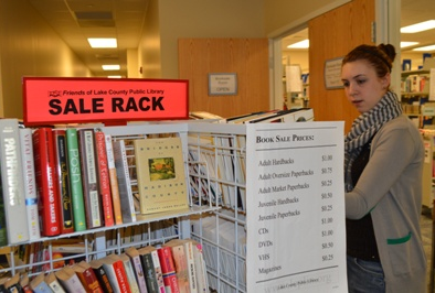 Look for the neon orange book sale rack sign!