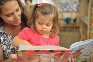 Sharing a book with a child is different from reading TO a child